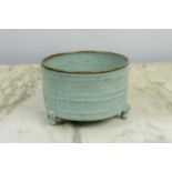 A CHINESE SONG STYLE RU WARE BOWL, in blush green craquelure glaze on tripod legs, 13cm D x 9cm H.