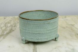 A CHINESE SONG STYLE RU WARE BOWL, in blush green craquelure glaze on tripod legs, 13cm D x 9cm H.