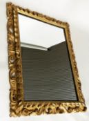 WALL MIRROR, late 19th century Florentine carved giltwood with scroll and leaf carved frame, 102cm x