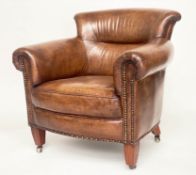 PROFESSOR STYLE TUB ARMCHAIR, buttoned aged brass studded tan leather with rounded back and arms,