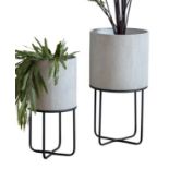 PLANTERS ON STANDS, two graduated pairs, in aged white finish, 30cm diam. x 58cm at largest.