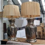 TABLE LAMPS, a pair, polished metal urn design, with shades, 91cm H. (2)