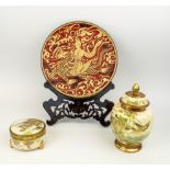 JAPANESE SATSUMA LIDDED VASE AND A LIDDED BOX and a metal and resin plate, plate 25cm diam, box 10cm