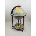 TERRESTRIAL GLOBE DRINKS CABINET, in 18th century style old world map, with rotating top and