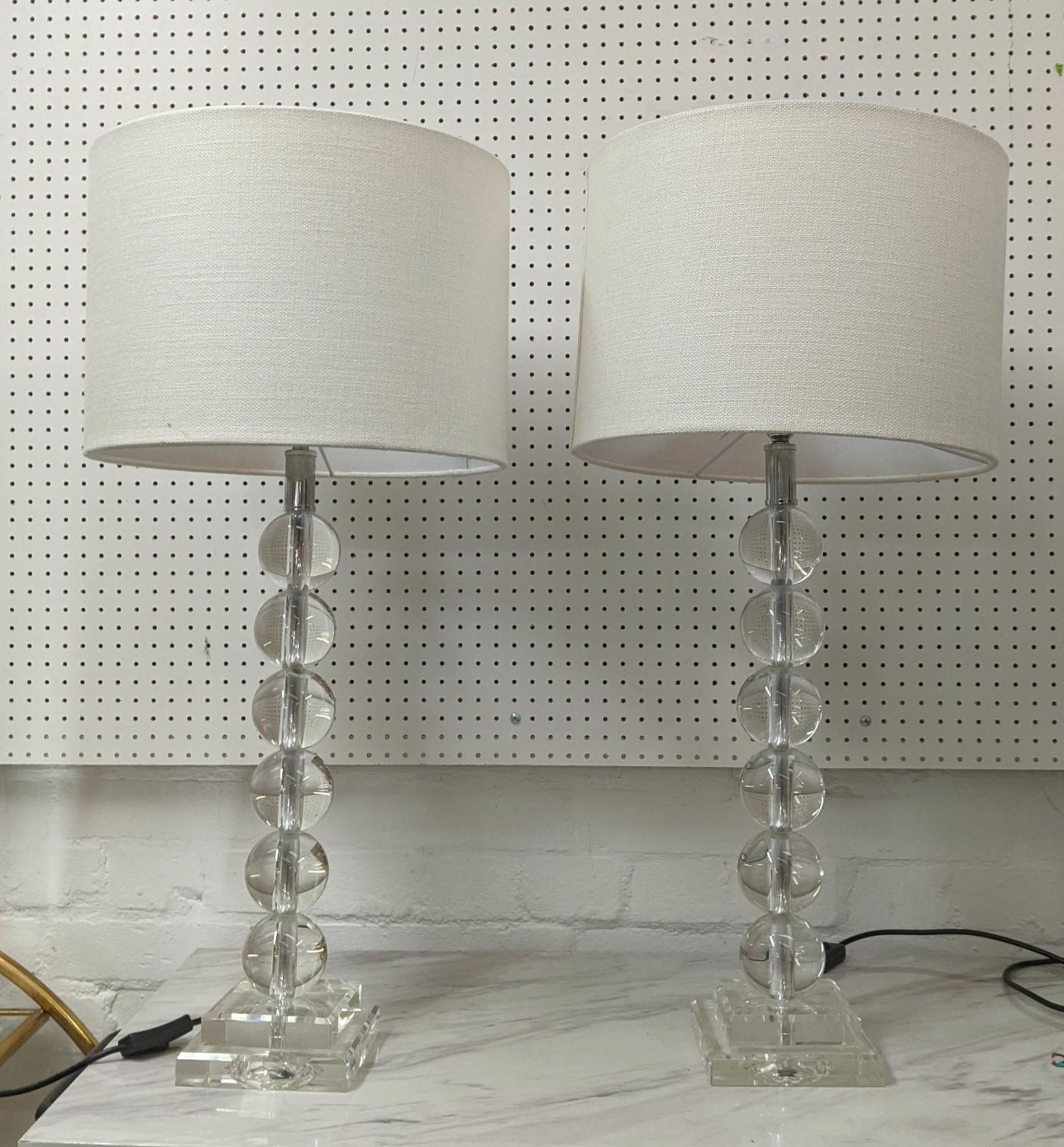 TABLE LAMPS, a pair, glass ball pillar form, white shades, 75cm H. (2)