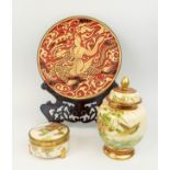 JAPANESE SATSUMA LIDDED BOX, a lidded vase and a metal and resin plate, plate 25cm diam, box 10cm