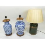 LAMPS, three, two Chinese blue and white with wood mounts and a green and gilt toleware lamp with