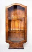 ART DECO DISPLAY CABINET, figured walnut with arched panelled glazed door and sides, and shaped