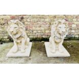 SCULPTURAL LIONS, a pair, 67cm high, 42cm wide, 54cm deep, pair, composite stone. (2)