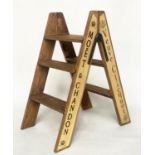 CHAMPAGNE STEPS, hinged A-frame, four tread with champagne house insignia, 80cm H x 44cm D x 69cm W.