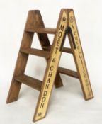 CHAMPAGNE STEPS, hinged A-frame, four tread with champagne house insignia, 80cm H x 44cm D x 69cm W.
