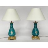 TABLE LAMPS, a pair, Chinese jade green ceramic and gilt of graduated form with gilt metal base,