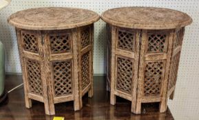 ASIAN SIDE TABLES, a pair, each 47cm H x 46cm W, the circular carved wood tops on folding bases. (2)