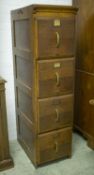 FILING CABINET, 147cm H x 39cm x 63cm, early 20th century oak of four drawers.