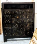 APOTHECARY'S CABINET, 19th century Chinese black lacquer with twenty-four drawers below larger