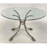 CENTRE/DINING TABLE, circular glass raised upon chromed and silver metal outswept supports with