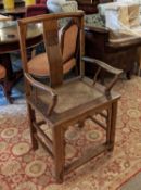 CHINESE ARMCHAIR, 57cm W x 106cm H, 19th century elm with carved detail and rattan seat.