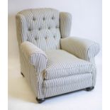 WING ARMCHAIR, 95cm H x 95cm, early 20th century in new ticking upholstery on brass castors.