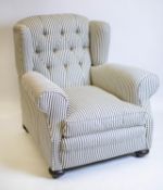 WING ARMCHAIR, 95cm H x 95cm, early 20th century in new ticking upholstery on brass castors.