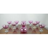 CRANBERRY GLASSES, a set of ten, with spiral twist stems and matching jug. (11)