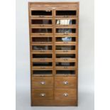 HABERDASHERY CABINET, mid 20th century oak with sixteen glass fronted drawers above four short