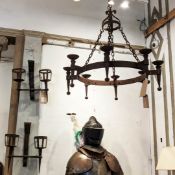 CANDLESTICK LAMPS, a pair, Medieval style wrought iron, a pair of wall twin arm castle touch