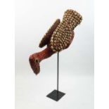 BAMILEKE STYLE BIRD MASK, Cameroon, decorated with red beads and cowrie shells, 57cm L.