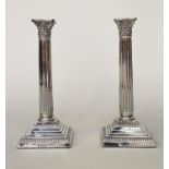 SILVER CANDLESTICKS, a pair, Corinthian column, fluted and stop reeded by Barker Bros Chester