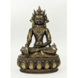 BRONZE FIGURE OF A BUDDHA, possibly 19th century, cast brass adornments, raised on a detachable