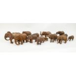 ELEPHANTS, fourteen, various sizes, hand carved wood. (14)