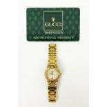 GUCCI LADIES WRISTWATCH, gold plated, Swiss made, calendar dial, water resistant, stamped '9200