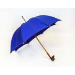 MAUD FRIZON PARIS VINTAGE UMBRELLA, 1960's with figural carved detailed shoe as handle, blue