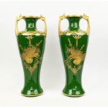 A PAIR OF ART NOUVEAU TWIN-HANDLED VASES, signed 'A. Peaudecerf', hand gilded decoration depicting