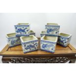 JARDINIERES, a set of eight, Chinese blue and white decorated with five claw dragons and
