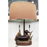 TABLE LAMP, in the form of a duck swimming by reeds, with shade 56cm H.