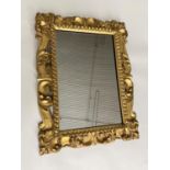 WITHDRAWN ITALIAN WALL MIRROR, 19th century Florentine carved giltwood with scrolling acanthus