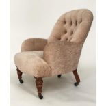 ARMCHAIR, Victorian walnut with chenille upholstery, buttoned back and turned supports, 66cm.