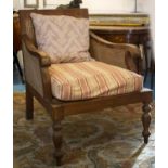 BERGERE, 97cm H x 74cm W x 90cm D, Colonial style teak and caned with striped squab and loose