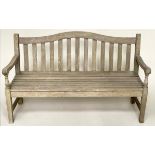 GARDEN BENCH BY BARLOW TYRE, weathered teak of slatted construction with arched back and turned