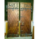 DOORS, each 231cm H x 75cm excluding hinges, a pair, early 20th century stained pine and iron