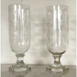 STORM LANTERNS, a pair engraved cut glass each with facetted stepped base, 40cm H. (2)