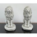 SEATED LIONS, a pair, 19th century style cast composite stone, 42cm H. (2)