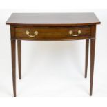 BOWFRONT WRITING TABLE, 77cm H x 85cm x 46cm, George III mahogany with frieze drawer, labeled