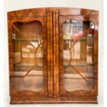 ART DECO DISPLAY CASE, figured walnut with arched top and two astragal glazed doors, 108cm W x 117cm