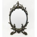 FRENCH CAST BRONZE DRESSING TABLE MIRROR, figural mounts, scrolled decoration inscribed indistinctly