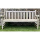 GARDEN BENCH, weathered teak of country house proportions and substantial slatted and pegged