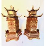 CHINESE STYLE PAGODA TYPE STORAGE CABINETS, lacquered decoration, 85cm high, 40cm diameter. (2)