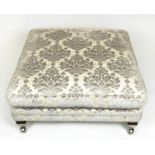DURESTA CENTRE STOOL, damask upholstered raised on square supports and castors, 45cm H x 93cm x
