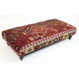 KILIM FOOTSTOOL, Anatolian kilim upholstered with turned supports, 35cm H x 137cm x 69cm.