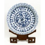 CHINESE CHARGER, Kangxi style, blue and white lobed with shaped border and chrysanthemum